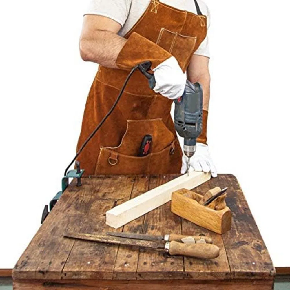 Tablier de soudeur en cuir de vache avec 6 poches pour homme - Résistant à la chaleur - Protection contre les flammes - Pour atelier de forgeron, armurier - Rangement d'outils - Motif croisé dans le