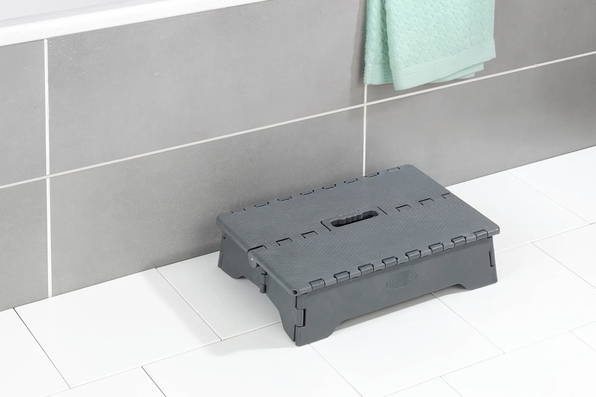 WENKO Marche Pliable | Marche très Stable avec Surface antidérapante jusqu'à 250 kg | Marche de sécurité Pliable Pieds antidérapants pour intérieur et extérieur | Poignet intégrée | 28x40x10cm